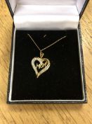 A 10ct gold diamond set 'Mom' pendant on chain