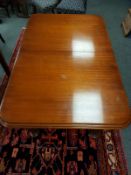 A Victorian style extending dining table, with leaf, and four 19th century mahogany chairs.