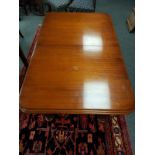 A Victorian style extending dining table, with leaf, and four 19th century mahogany chairs.