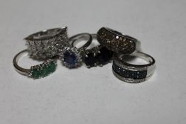 Six silver dress rings