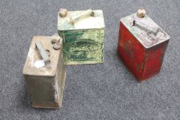 Three petrol cans : Shell, Esso and Pratts,