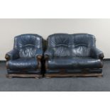 A wood framed blue leather upholstered two seater settee with matching armchair