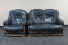 A wood framed blue leather upholstered two seater settee with matching armchair