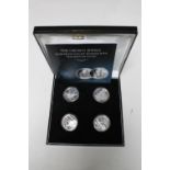 The Crown Jewels Silver Proof Coin Set by The London Mint, four $10 coins set with a diamond, ruby,