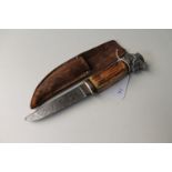 A novelty hunting knife with horn handle in leather sheath CONDITION REPORT: 21cm