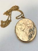 A 9ct gold locket on gilt metal chain CONDITION REPORT: 17.3g (locket).
