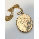 A 9ct gold locket on gilt metal chain CONDITION REPORT: 17.3g (locket).