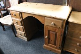 A pine desk fitted five drawers