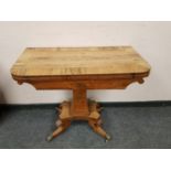 An early 19th century rosewood card table,