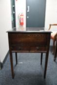 An oak sewing box with contents