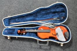 A modern violin and bow in fitted hard case
