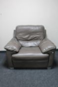 A brown stitched leather electric reclining armchair
