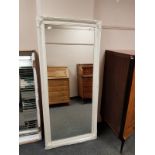 A traditional cream framed mirror,