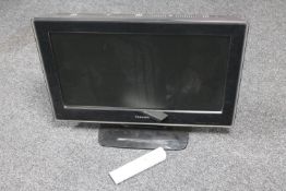 A Toshiba 26" LCD TV with remote