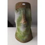 A stone Easter Island head figure
