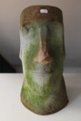 A stone Easter Island head figure