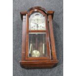 A Tempus Fugit wall clock with pendulum,