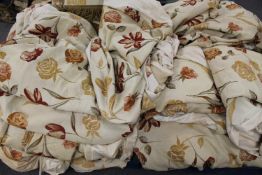 A large quantity of good quality floral curtains with pelmets