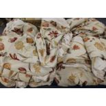 A large quantity of good quality floral curtains with pelmets