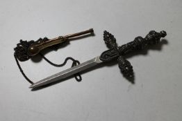 A small ceremonial dagger and a boson's whistle
