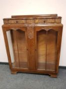 A 1930's carved oak display cabinet, probably Lees,