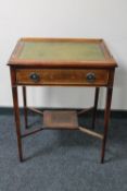 An Edwardian side table with green baize top