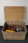A wicker storage crate containing rope,