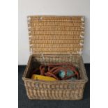 A wicker storage crate containing rope,