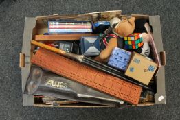 A box of toys, cribbage board, rubix cube, police phone box,