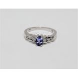 A 14ct white gold tanzanite and diamond ring, size N.