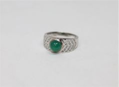 An 18ct white gold cabochon emerald and diamond ring, 6.