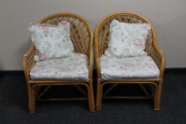 A pair of cane conservatory armchairs