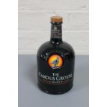 The Famous Grouse Liqueur, an infusion of citrus fruits, spices, Scotch & Bourbon Whiskies. 1 litre.