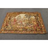 A large tapestry wall hanging depicting figures hunting