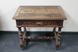 A 19th century carved oak side table