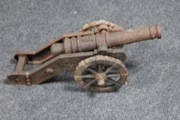 An antique cast iron model of a signal cannon