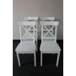 A set of four painted wooden dining room chairs