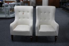 A pair of armchairs in oatmeal fabric