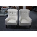 A pair of armchairs in oatmeal fabric