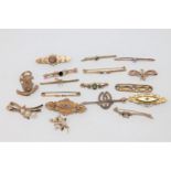 A good collection of seventeen gold brooches variously set with garnet, peridot, seed pearls,