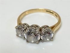 A 14ct gold three stone ring,