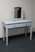 A modern grey dressing table with mirror