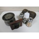 A small travelling inkwell, opera glasses in case,