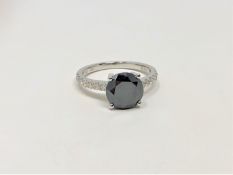 A 14ct white gold diamond ring, featuring centre round brilliant cut black diamond (1.