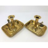 A pair of early 19th century brass rise and fall chambersticks (2)