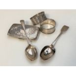 A quantity of silver items : cigarette case, napkin rings,