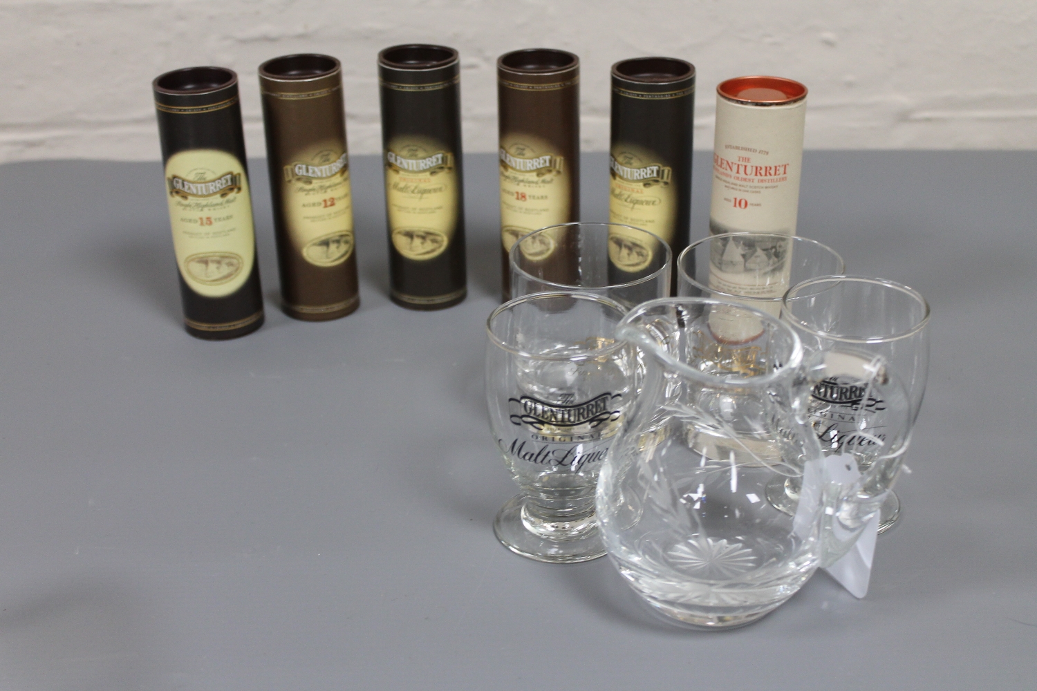 Six miniature bottles of whisky, in tubes, Glenturret 10 years,