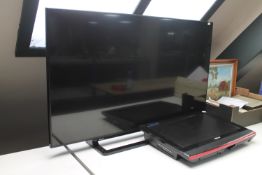 A Toshiba 48" LCD TV and a Baird TV screen
