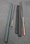Four vintage fishing rods in carry cases
