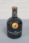 The Famous Grouse Liqueur, an infusion of citrus fruits, spices, Scotch & Bourbon Whiskies. 70cl.